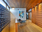 The oak-clad second level has long hallways off the main rotunda, as well as the master bedroom, space for an office and access to two balconies