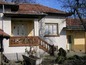 House for sale near Lovech. An appealing house with a private well and a front garden with flowers.