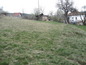 Land for sale near Sofia. Well-sized plot suitable for a family house, overlooking a small town